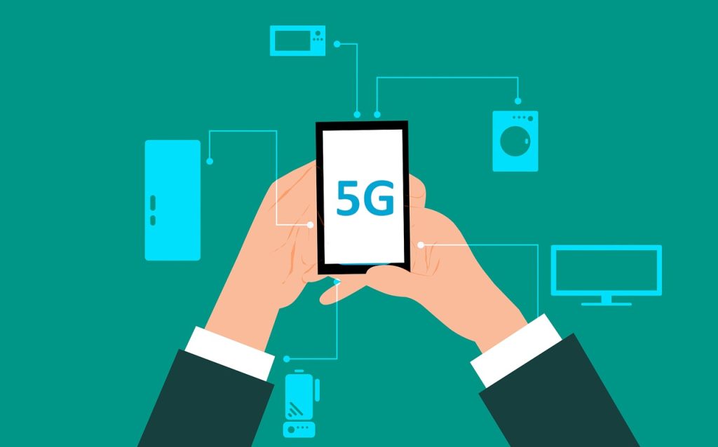 How will 5G Impact Mobile Payments - Man Holding 5G Compatible Mobile Smartphone