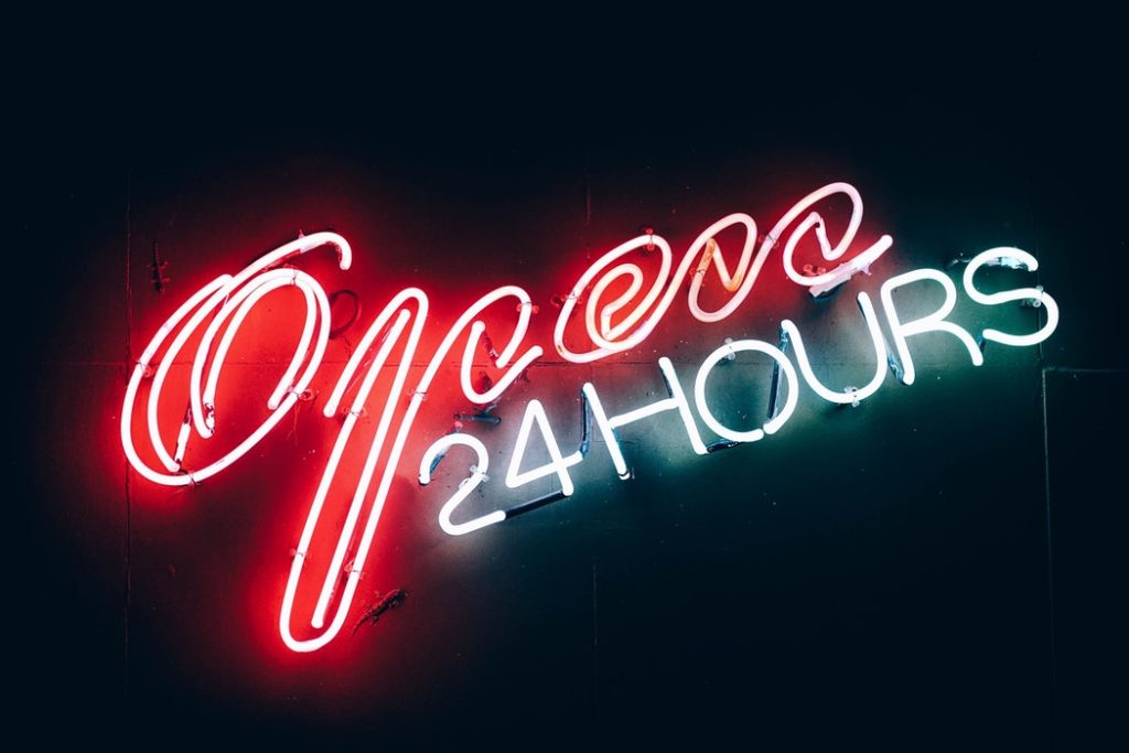 open 24 hours red and white neon sign