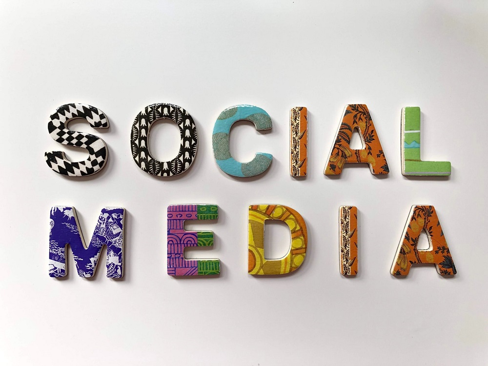 social media spelt out in different colored letters on white background